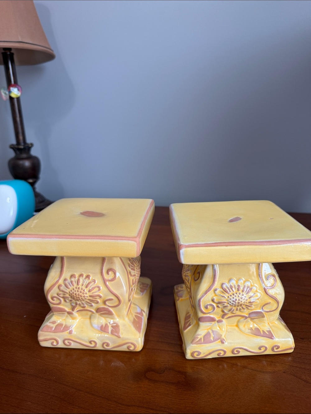Yellow Floral Ceramic Pedestal Pair - Unknown Brand. I small chip on top of one